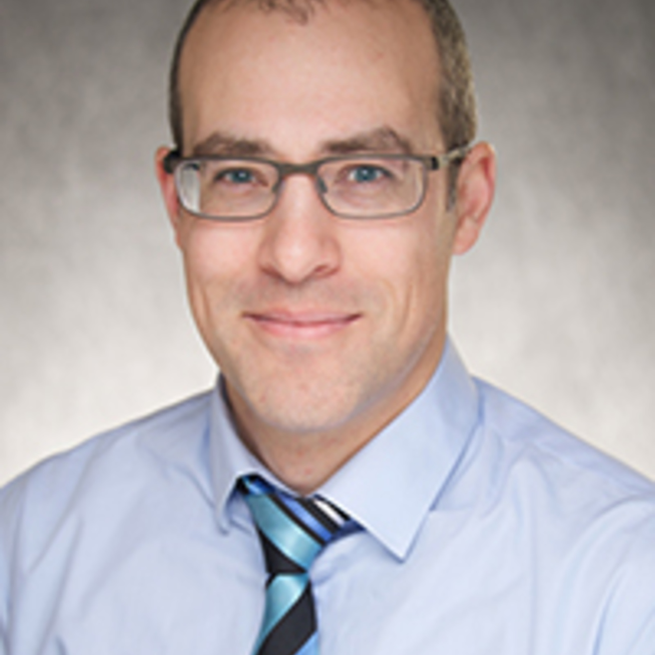 Headshot of Joel St-Aubin.